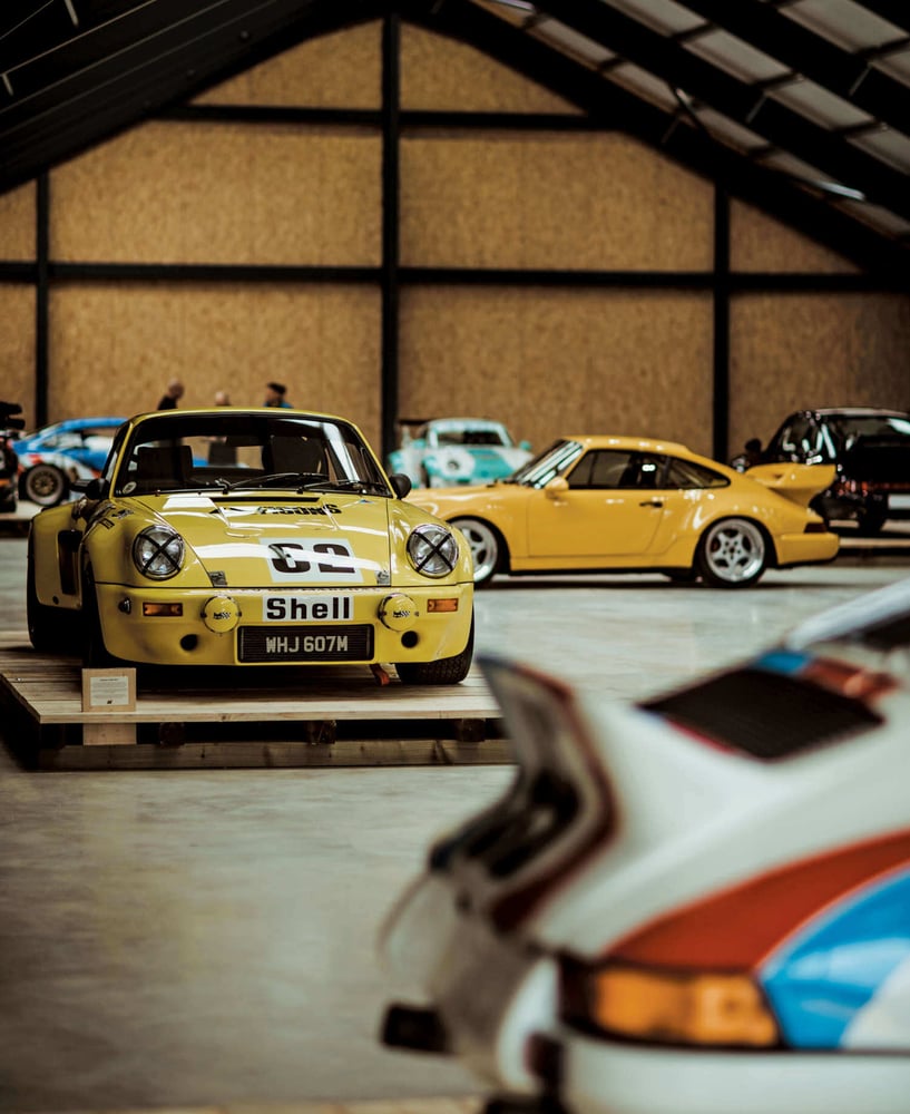 Some yellow Porsche cars.