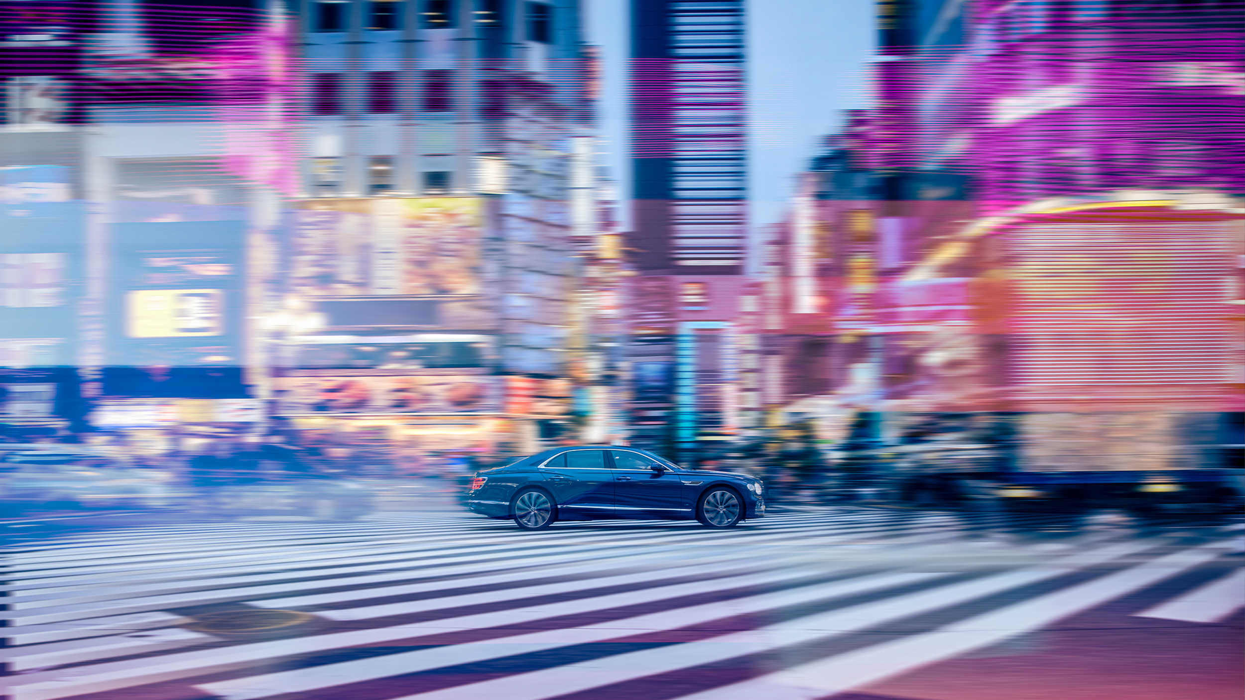 Bentley motor car driving through Japan
